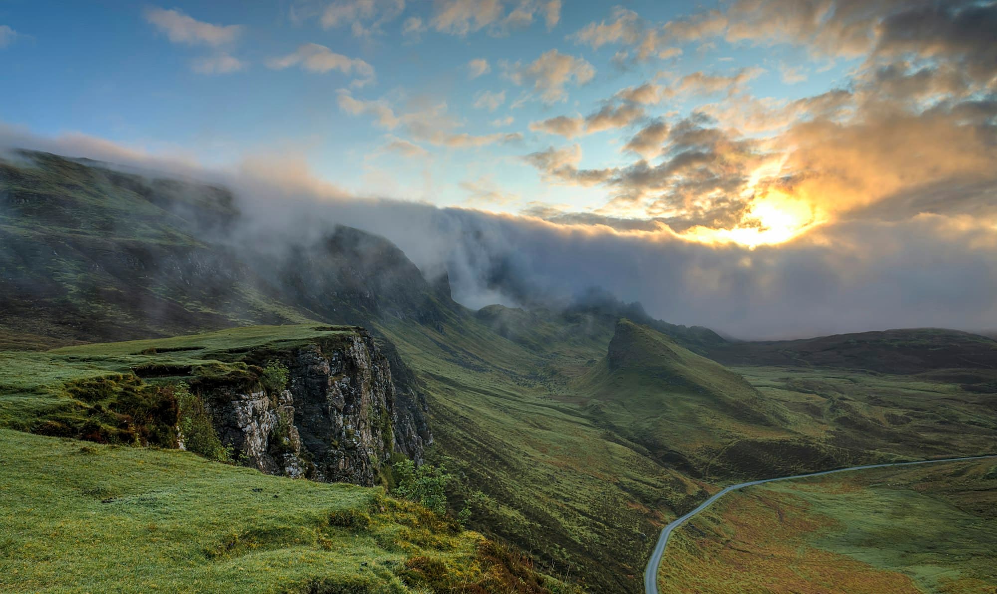 Layered mountain ridges in fog
